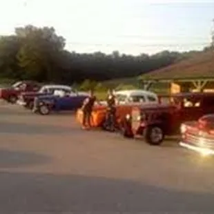 a line of trucks parked in a parking lot