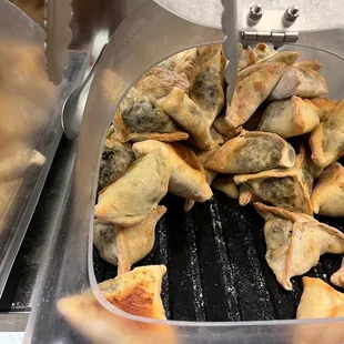 a pan of dumplings being cooked