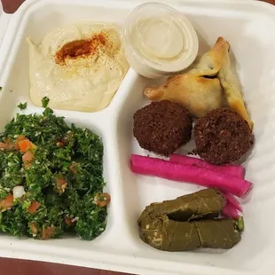 2 falafels, 1 spinach pie, 2 stuffed veggie grape leaves, hummus, taboule salad, tahini sauce, pickled turnips, pita bread - $12.50 delish