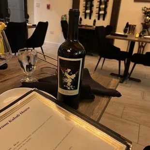 a bottle of wine on a table