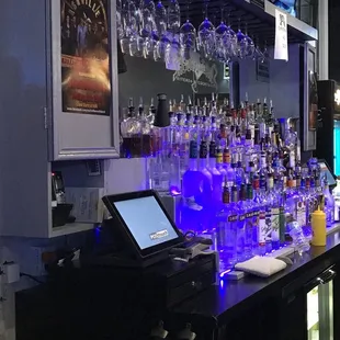 a bar with a lot of wine glasses
