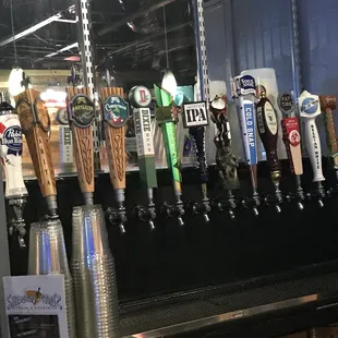 a row of beer taps