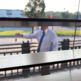 Holding a mouse we just caught in the restaurant