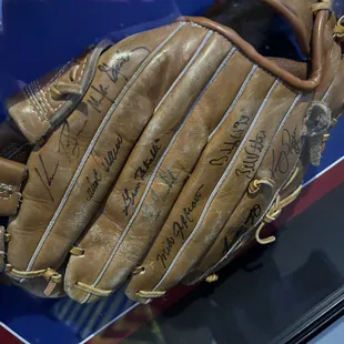 Glove signed by Rangers HOFers