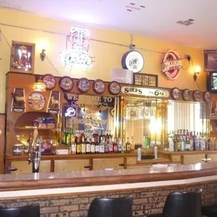 a bar with a clock on the wall