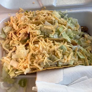 a taco in a styrofoam container