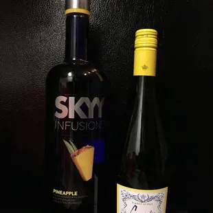 a bottle of skyy infusionion and a bottle of pineapple