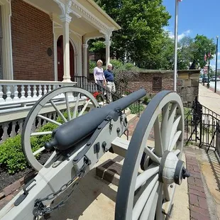 A restored Civil War cannon stands guard at the Sherman House Museum.