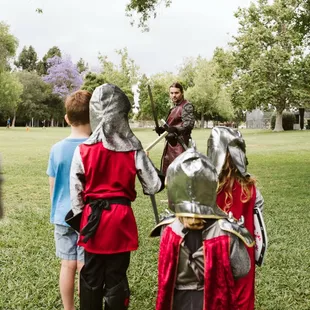 Sir Con teaching the kids to fight. Running, agility and one to one sword fighting moves.
