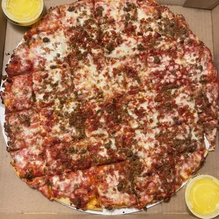 Medium pepperoni and sausage thin crust pizza with extra garlic butter