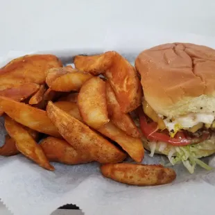 Bacon burger with fried egg and wedges