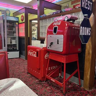 a coca cola machine in a diner