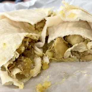 Curry chicken roti (we cut into it that&apos;s why it looks like this) just order it though