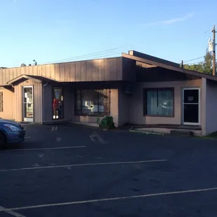 a car parked in front of the restaurant