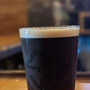 a pint of dark beer