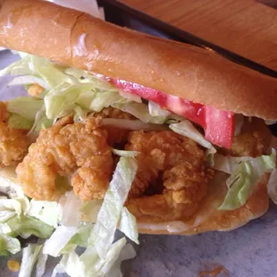 a sandwich with shrimp and lettuce