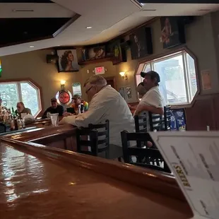 people sitting at the bar