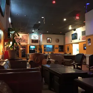 the inside of a restaurant with tables and chairs