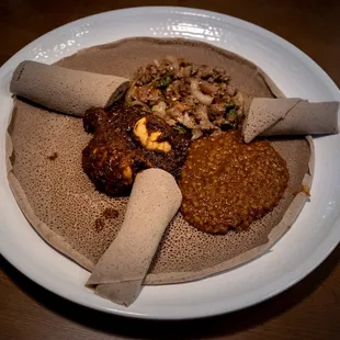 Dinner combo where you pick 3 items. Fed 2 very hungry people. We chose chicken, lamb, and red lentil items.