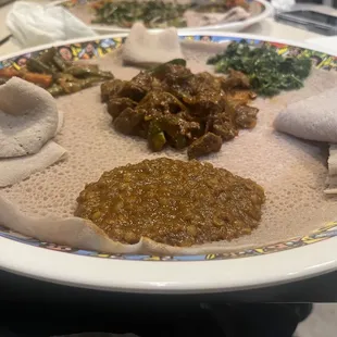 a plate of ethiopian food on a table