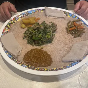 a person holding a plate of food