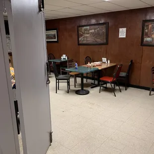 a dining room with tables and chairs
