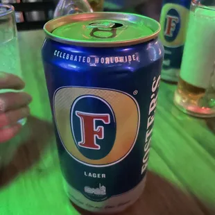 a can of beer on a table