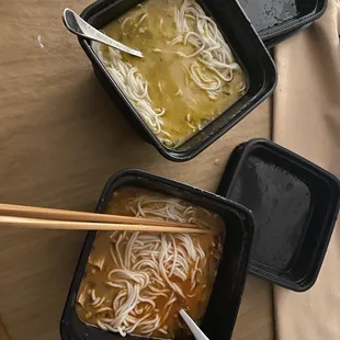 three bowls of soup with chopsticks