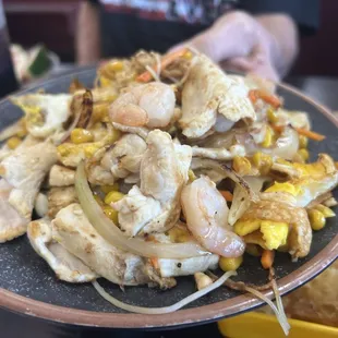 Hibachi - you pick you raw ingredients and the Hibachi cook makes it and brings it to your table.