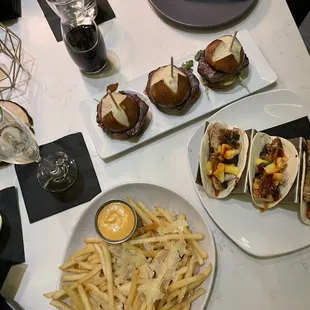 Filet sliders, fries, halibut tacos