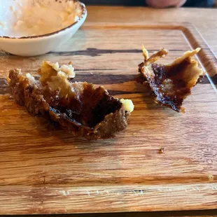 Skin of fried chicken. Inedible.