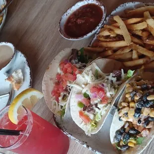 2 steak tacos, salmon taco with street corn. The strawberry lemonade cocktail pictured here was SO good