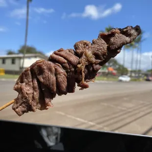 BBQ beef stick. I wish it was more grilled with grilled marks and less rubbery prying off the stick. Tasted like vinegar shoyu  marination.