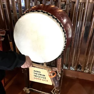 a man holding a drum