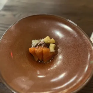  close up of a dish of food on a brown plate