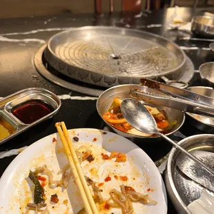 a plate of food with chopsticks