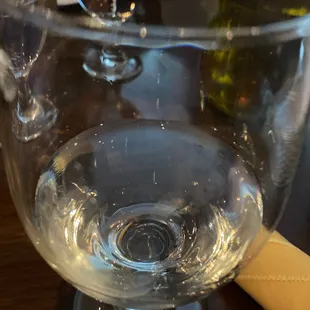 a glass of wine on a table