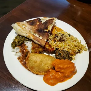 Assortment of curries with vegetarian and chicken options
