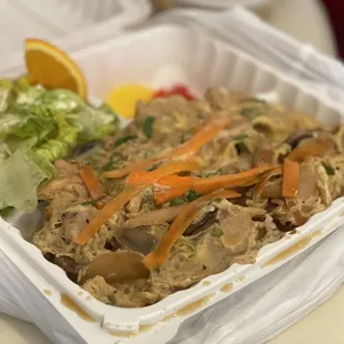 a meal in a styrofoam container