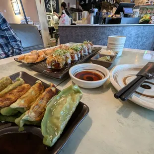 Veggie Gyoza in the foreground. Ultimate Tuna sushi and honey  walnut prawns.