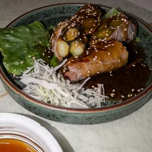 Asparagus wrapped in thinly sliced beef.