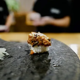 Unagi topped with crispy rice balls