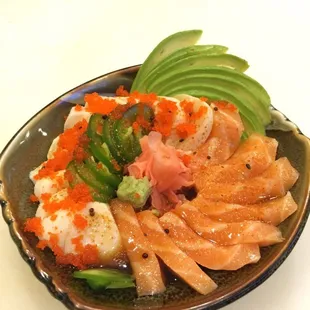 Salmon belly, super white tuna topped with jalapeños, masago, avocado and finish off with yuzu sauce.