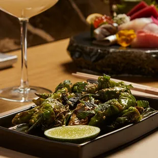 a plate of food and a glass of wine