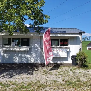 two people standing in front of a building