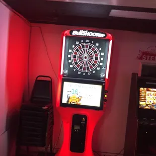 a darting machine with a red light