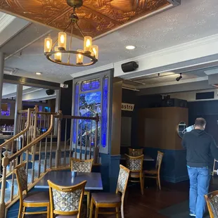 a man taking a picture of a restaurant