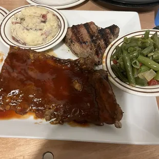 Ribs, green beans, mashed potatoes, steak