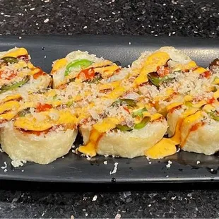 a plate of sushi rolls