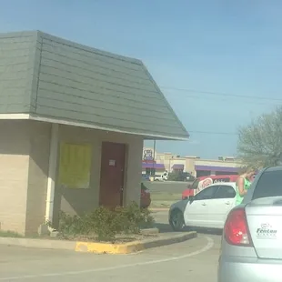 Long line of cars! A girl came out to take orders.